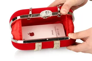 Red velvet evening clutch bag with rhinestone U-frame and chain detail, detail view showing capacity.