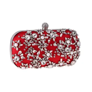 Red satin evening clutch bag with sparkling rhinestones and pearls, elegant wedding purse.