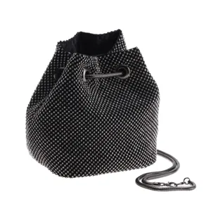 Black rhinestone bucket bag detailed view, sparkling evening purse with metal chain strap.