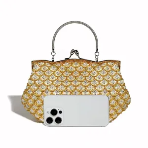 Exquisite beaded fish scale evening bag with metal handle and kiss-lock closure for women.