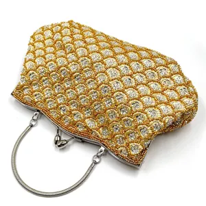 Elegant gold beaded evening clutch bag with metallic fish scale design for women party.