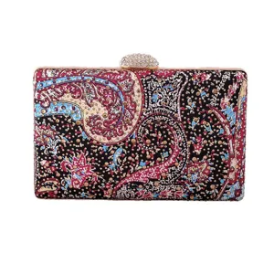 Exquisite evening clutch bag detail, ornate paisley print with rhinestones and crystal clasp.