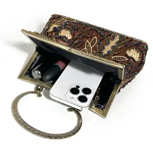 Vintage beaded evening clutch bag capacity detail view with metal handle for women retro style.