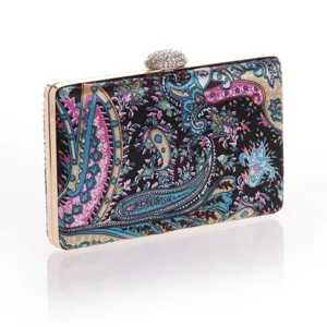 Detail view of colorful paisley pattern evening clutch bag with gold metallic frame and rhinestone.