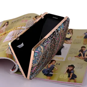 Elegant rhinestone evening clutch bag with metallic frame and chain for women parties.