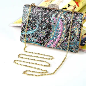 Exquisite rhinestone evening clutch bag with colorful paisley print and metal chain for women.