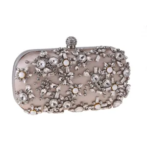 Stunning rhinestone evening clutch bag with pearl floral details, perfect for weddings and parties.