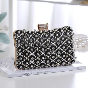 Elegant black evening clutch bag with sparkling rhinestones and pearl embellishments for party.