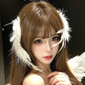 Close-up detail shot of the white feather hair clip, showing soft texture and fine craftsmanship.