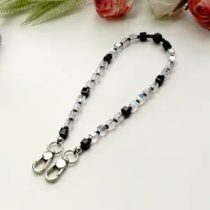Chaîne de téléphone en perles de cristal noir et blanc pendentif de sac élégant