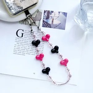 Elegante correa de móvil con cristal de corazón y llavero de bolso con cuentas.