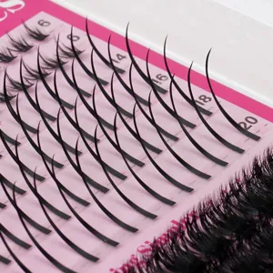 Detailansicht von DIY segmentierten künstlichen Wimpern auf rosa Schale mit verschiedenen Längen.