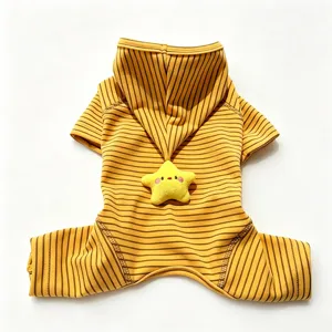 Close-up detail of the cute yellow striped pet onesie featuring a soft plush star and warm hood.