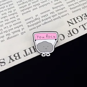 Cute metal enamel pin badge featuring a funny motivational rock design for backpack decor.
