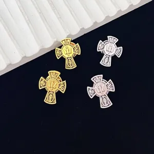 Vintage four holy cross brooch featuring holy spirit dove relief metal badge detail.