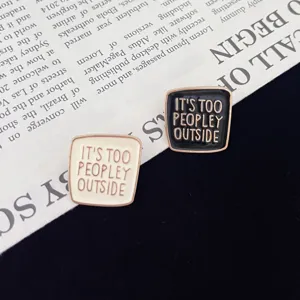 Detailed shot of trendy alloy enamel letter brooch pins, creative accessory for outfits.