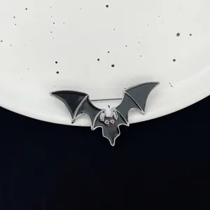 Halloween gothic bat brooch pin with red eyes, quirky enamel badge for apparel accessories.