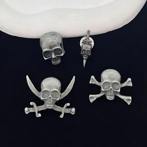 Vintage Gothic skull and crossbones brooch set, antique silver tone Halloween clothing pin.