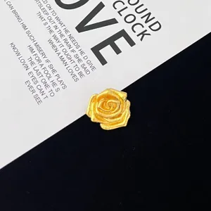 Retro gold rose brooch for women, elegant metallic flower pin for clothing decoration and styling.