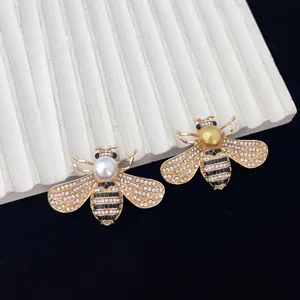 Fashion creative insect bee brooch with full rhinestones and pearl detail for chic suit coat decor.
