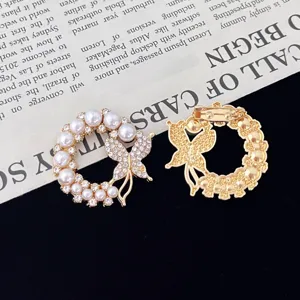 Exquisite pearl butterfly wreath brooch detail, gold-tone alloy with sparkling rhinestones.