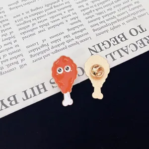 Cute cartoon fried chicken leg alloy enamel brooch, creative food lapel pin accessory detail.