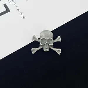 Vintage gothic skull and crossbones brooch pin for Halloween alternative fashion outfit decor