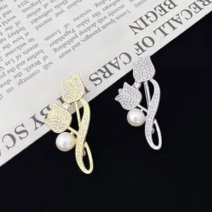 Elegant tulip brooch pin with sparkling rhinestones and pearl accent for women fashion wear.