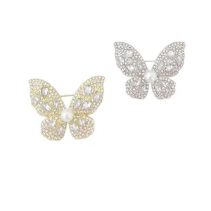 Elegant rhinestone crystal butterfly brooch set featuring sparkling stones and pearl accents.