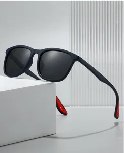Detail view of stylish dark blue sunglasses with red accents, perfect for outdoor sports and cycling.