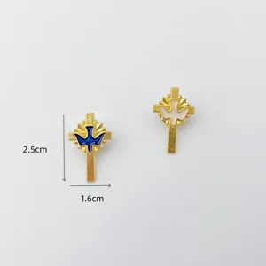 Detail shot of metal cross dove brooch, enamel finish, exquisite clothing accessory pin.