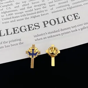 Metal peace dove cross brooch lapel pin detail view, fashion clothing accessory pin.
