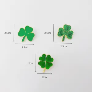 Detailed view of fashionable green clover enamel brooches, cute shamrock pin accessories.