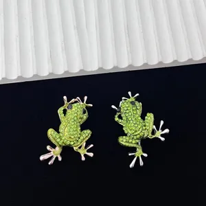 Green rhinestone frog brooch detailed shot showcasing sparkling crystal embellishments.