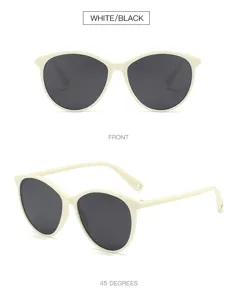 White frame oval sunglasses with dark lenses, stylish retro design for sun protection.