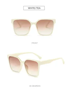 Chic oversized square sunglasses featuring white frames and gradient brown lenses for a stylish street look.