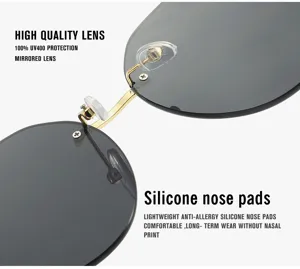 Bügellose Sonnenbrille mit goldfarbenem Metallgestell, grauen Gläsern und Silikon-Nasenpads.