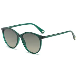 Green translucent oval sunglasses with gradient grey lenses, stylish sun protection eyewear.
