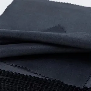 Close up view of black microfiber glasses cleaning cloth detail, soft fabric texture.