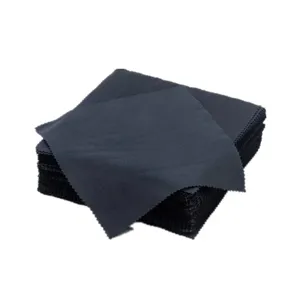 Detailed close-up view of black microfiber cleaning cloth, soft fabric texture and zigzag edge.