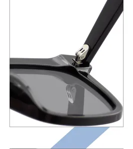 Close-up detail shot of black sunglasses metal hinge structure and durable frame design.