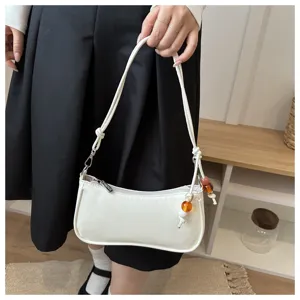 White underarm shoulder bag with chic beaded charm, elegant daily casual crossbody bag style.
