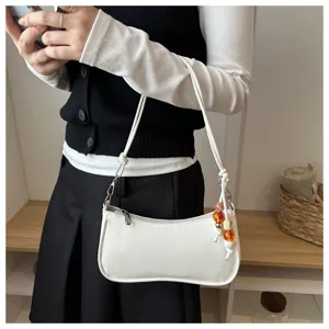 Trendy minimalist white shoulder bag for women, chic underarm bag with beaded charm casual.