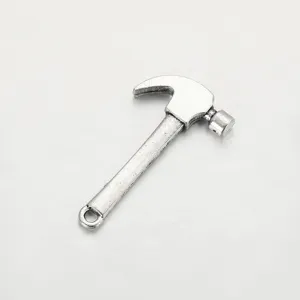 Detailed close-up view of silver alloy hammer pendant for DIY handmade jewelry necklace crafts.