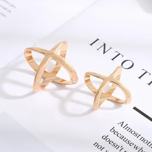 Minimalist cross design silk scarf buckle metal clothing corner clip fashion accessory.