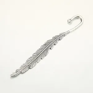Details of vintage feather shape metal alloy bookmark pendant for DIY handmade jewelry crafts.