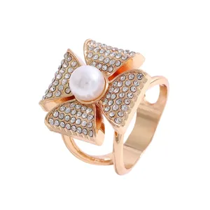 Golden rhinestone pearl four leaf clover silk scarf buckle ring clothing corner clip accessory.
