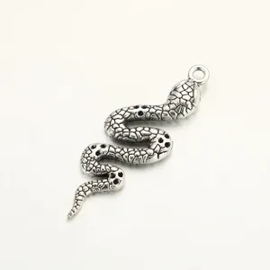 Retro silver snake pendant detail shot, antique alloy DIY jewelry accessory for necklace bracelet.