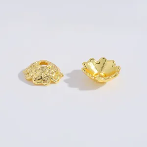 Gold alloy flower bead caps detail shot, hollow spacer beads for DIY jewelry making accessories.