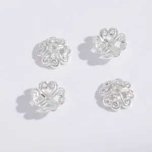 Silver hollow flower bead caps for DIY jewelry making, metal spacer beads for bracelets.